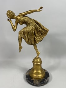 GILT BRONZE FIGURAL GROUP OF A DANCING LADY