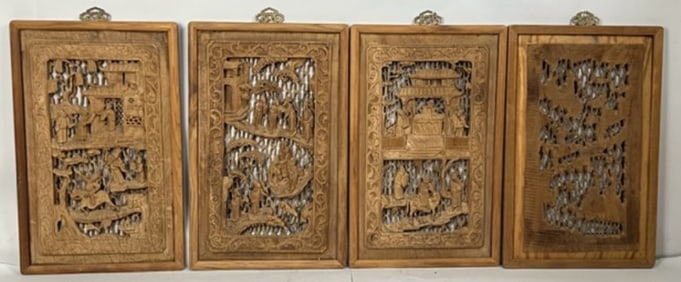 SET OF FOUR HAND-CARVED WOODEN PANELS