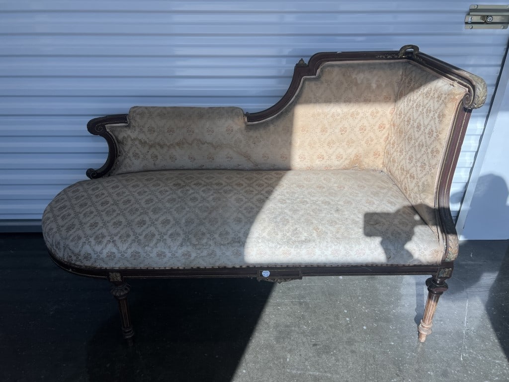 19TH C. VICTORIAN-STYLE CHAISE LOUNGE: A beautiful 19th century Victorian-style gilt bronze mounted chaise lounge. With asymmetrical design with one high, upholstered armrest and a sloped backrest. Gilt bronze mounts on the wooden frame, a