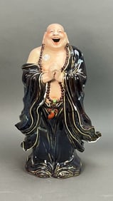 CHINESE PORCELAIN FIGURE OF A STANDING BUDDHA