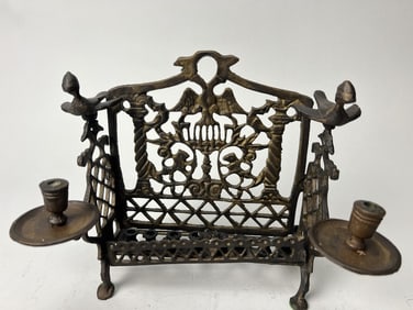 AN EUROPEAN METAL FRAME WITH CANDLE HOLDERS