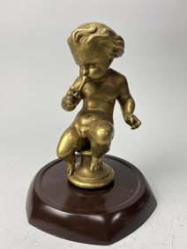 GILTBRONZE FIGURE OF A CHERUB