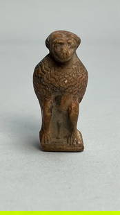 SMALL CARVED FIGURE, OF AN EGYPTIAN GOD THOTH: In Egyptian mythology, a baboon sculpture, where it is seated with its hands resting on its knees, is associated with the Egyptian god Thoth. He is god of wisdom, writing, magic, and the moon. The