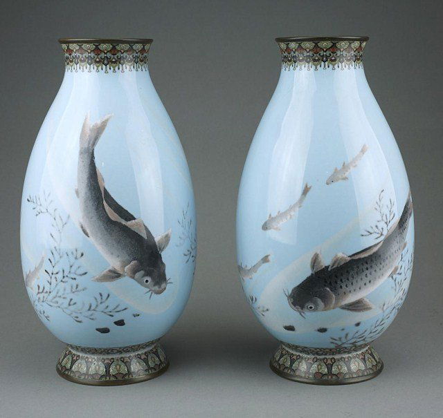 PAIR OF CLOISONNE MEIJI PERIOD VASES WITH KOI DESIGN: Of a graceful ovoid shape and bronze rims, depicting of swimming koi and other fishes on powder blue ground, on enameled circular foot. H: 12 1/2 in.