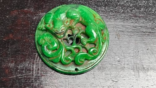 CHINESE ROUND JADE PENDANT, OF A CHILONG