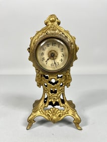 SMALL ELEGANT EUROPEAN GILT BRONZE CLOCK