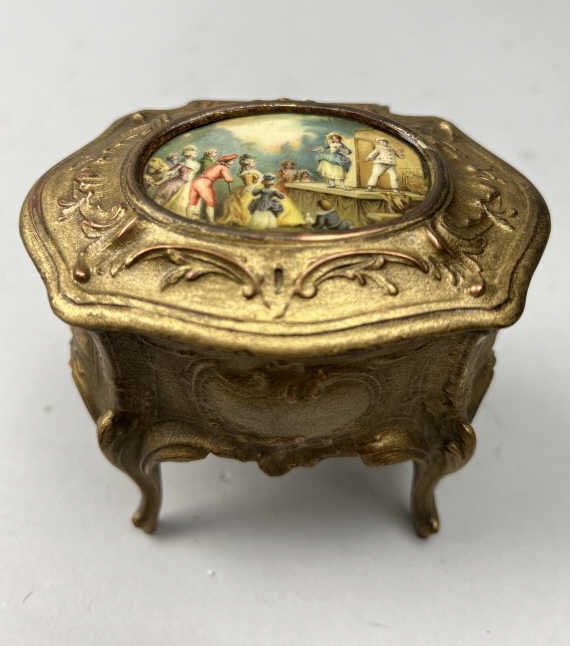 BEAUTIFUL FRENCH GILT BRONZE JEWELRY BOX: With a city street scene in relief on the hinged cover. L: 4 1/4 in. W: 3 1/4 in.