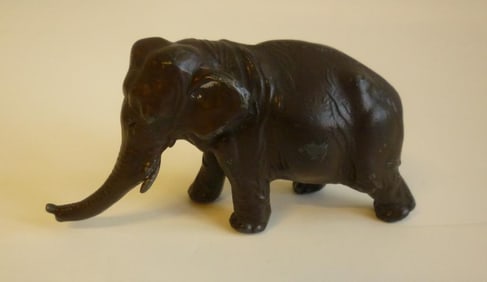 SMALL CARVED BRONZE FIGURE OF AN ELEPHANT