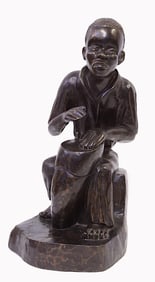 CARVED WOODEN STATUE OF A MUSICIAN