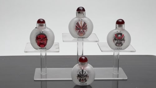 SET OF FOUR GLASS SNUFF BOTTLES