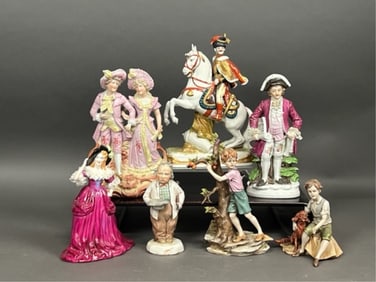 GROUP OF TEN EUROPEAN PORCELAIN FIGURES