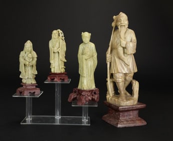 FOUR CHINESE CARVED SOAPSTONE FIGURES ON STANDS