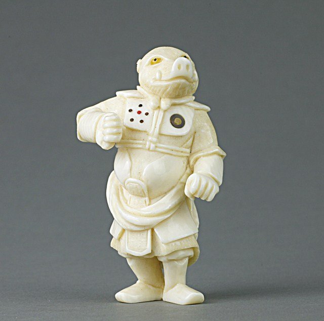 JAPANESE CARVED IVORY NETSUKE OF A BOAR: From the Private collection of Mr. Paul Siegal. Signature on the base. H: 2 3/8 in.