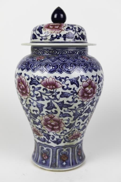 FINE CHINESE PORCELAIN LIDDED TEMPLE JAR: Featuring traditional blue and white cobalt decoration with additional red enamel highlights. Made of fine porcelain with glazed finish, and designed with lotus patterns. has bulbous body with a fitte