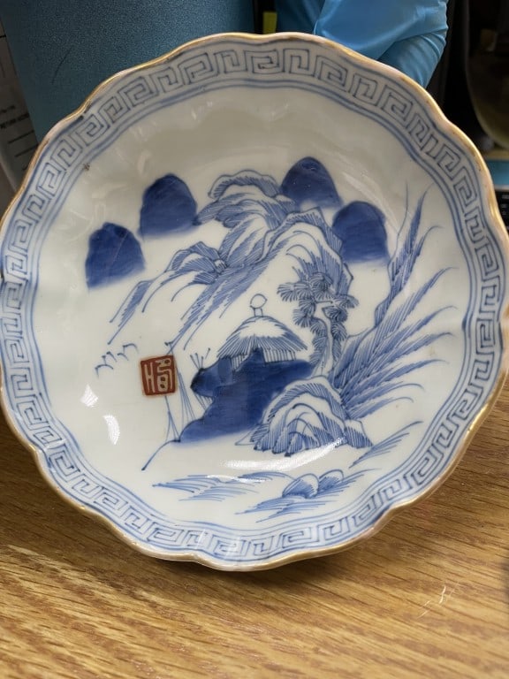 JAPANESE MEJI PERIOID BLUE & WHITE BOWL: Painted centrally with a landscape scene with a red mark on the lower left.
