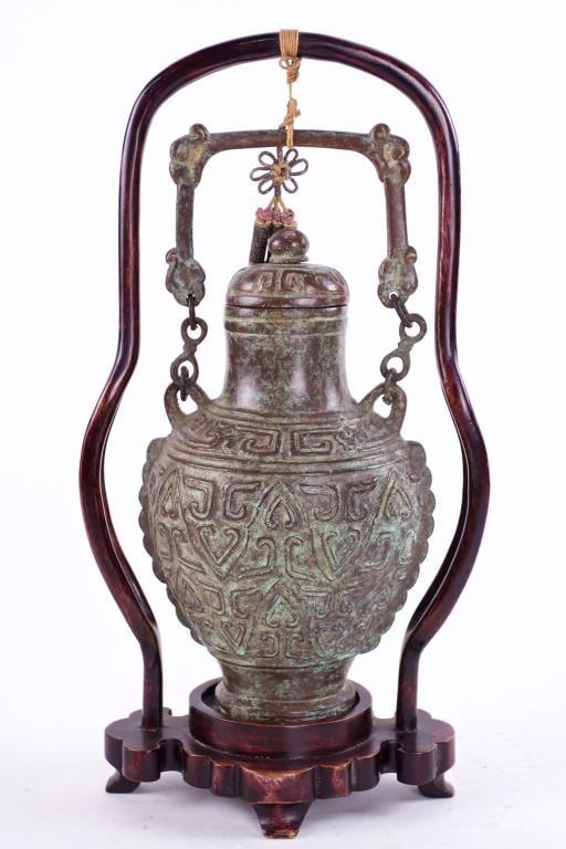 CHINESE SHANG DYNASTY BRONZE VASE: Of Shang Dynasty and it is made of copper alloy. Of compressed form raised on a pronounced high foot, carved in relief to the body with a taotie mask. H: 9 3/4 in. Private Collection of a California C