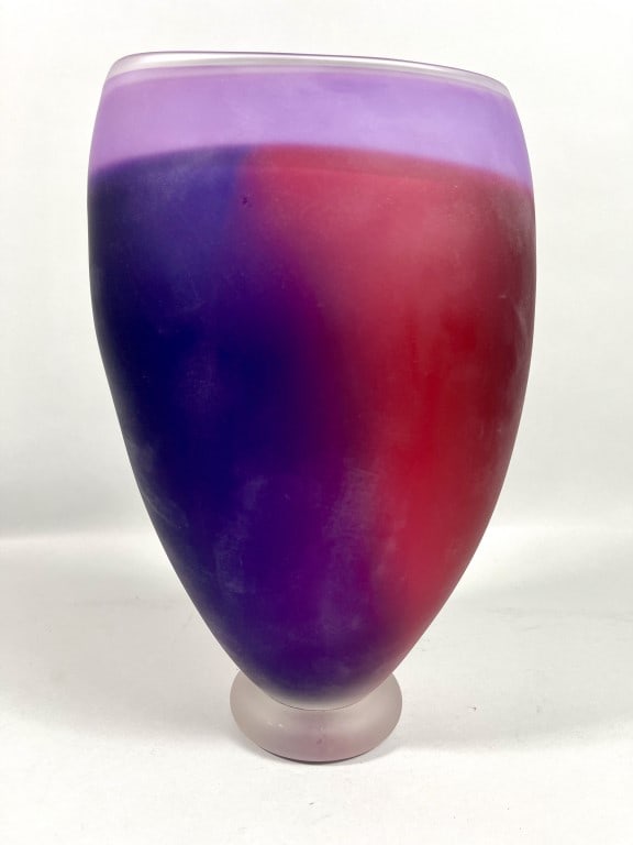 GARY BOLT, CANADIAN: A beautiful large art glass vase. The frosted glass vase blends from deep amethyst to cranberry with an lavender shoulder; seated atop of a frosted colorless base. Signed on the bottom to read Gary Bo