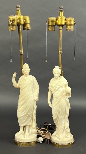 PAIR OF EUROPEAN BLANC DE CHINE FIGURES: Converted as lamps. The blanc de chine figures are modeled as a man and a woman in a draping robes respectively, and raised on a gilt bronze plinth. Shades not included. H: 23 1/4 in.