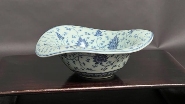 CHINESE BLUE AND WHITE FLARED RIM BOWL: Bearing floral motif all over. H: 3 1/2 in.