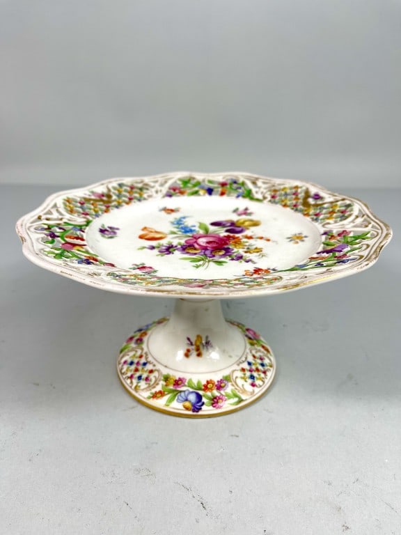 EUROPEAN PORCELAIN STEMMED REVOLVING CAKE SERVER: Beautifully painted with flowers all over, marks on the bottom. H: 4 1/4 in. L: 8 1/4 in.