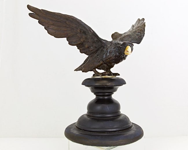 JAPANESE BRONZE EAGLE STATUE: Atop a round raised plinth, with its wings in spread posture. H: 13 1/2 in.