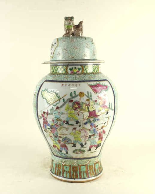 GILDED FAMILLE ROSE HAND-PAINTED PORCELAIN VASE: Six-character mark to read Tongzhi on the shoulder of the vase. Flanked by a foo lion on top of the lid as finial. H: 29 1/4 in. (74.3 cm)