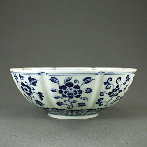 CHINESE BLUE AND WHITE BOWL: A blue and white bowl with floral motif decoration. The mark at the bottom writes: This is for the general who won the West-conquering war by Emperor Xuanzong in the 2nd year of Xuande Era Ming Dynast