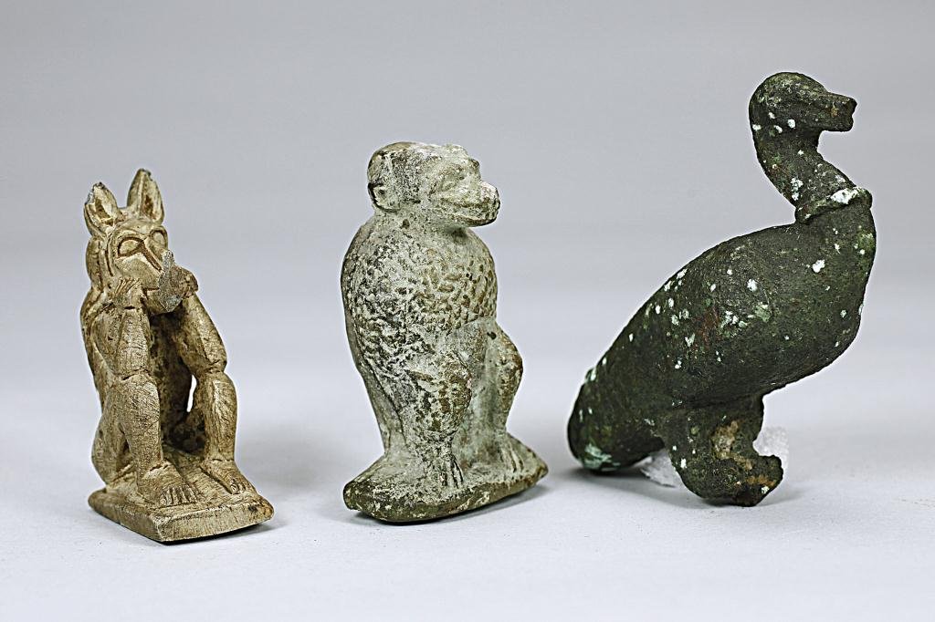 GROUP OF BRONZE AND TERRACOTTA FIGURES: From the British School of Archaeology in Egypt. Comprising of a bronze ibis, a baboon and a jackal. H: 2 1/4 in.