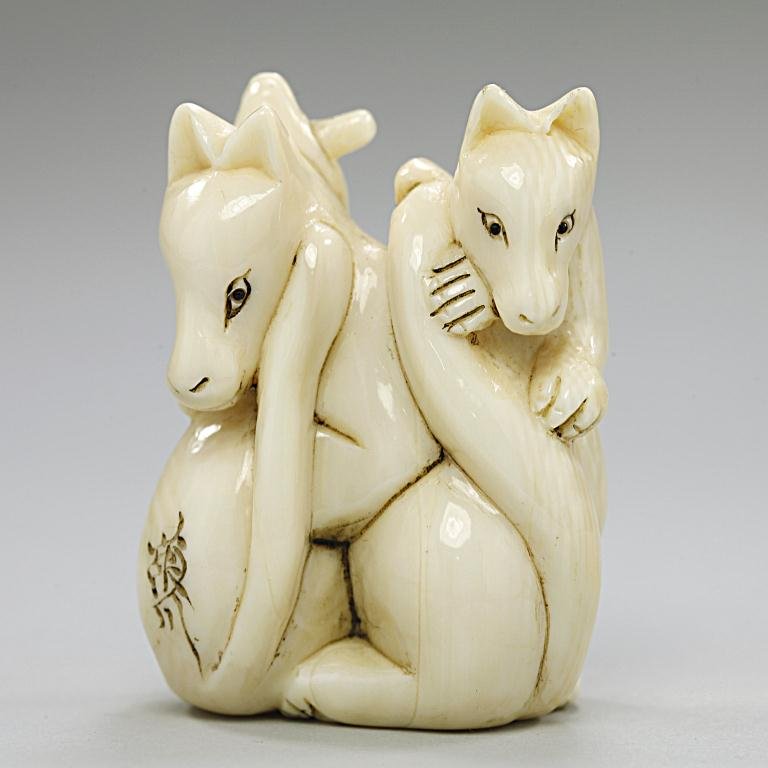 Antique Japanese Ivory Netsuke: of a skulk of foxes. Signature to read, Eison. H: 1 7/8 in.
