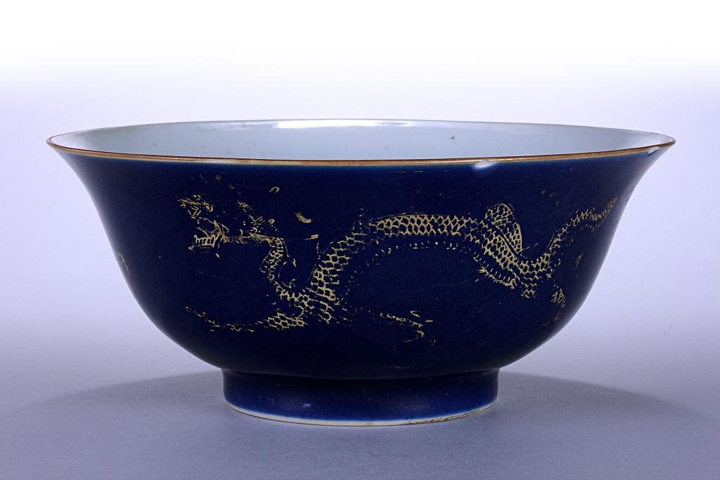 Antique Chinese Blue Ground 'dragon' Bowl: With gilt outline of two dragons after a flaming pearl. Six character mark on the base to read Qianlong reign. Diameter: 7 5/8 in.(19.5cm) x H: 3 1/4 in.(8.5cm)