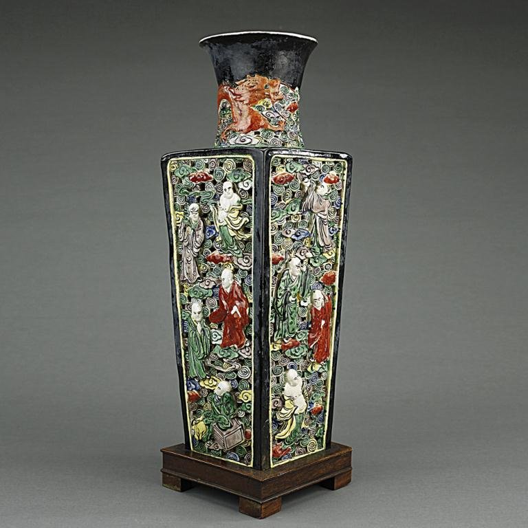ANTIQUE CHINESE RETICULATED SQUARE VASES: 19th Century, Chinese reticulated square vase decorated with the eighteen arhats amidst auspicious clouds on the four black porcelain surfaces and a red dragon circles around the neck. H: 16 1/4 in.