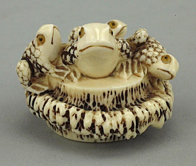 JAPANESE CARVED IVORY NETSUKE OF FOUR FROGS: H: 1 in.