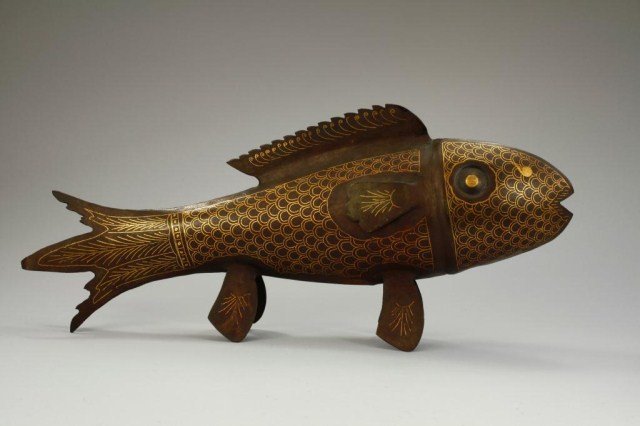 HANDMADE IRON FISH SCULPTURE: Handmade iron design of a fish with inlaid gold detailing of scales on the body and fins. H: 7 3/4 in. L: 18 1/4 in.