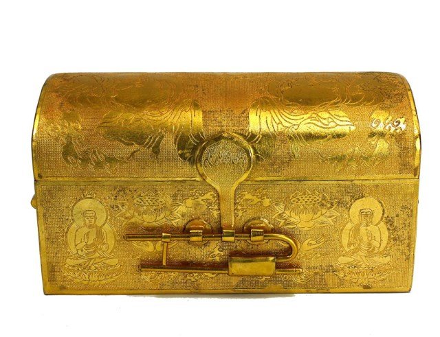 CHINESE GILTBRONZE TREASURE BOX WITH TWELVE SUTRAS: Two handled box is embossed with Buddhas and Buddhist symbols. Inside the box are twelve folding gilt bronze Buddhism sutras, each in its own separate box. H: 4 1/2 in. X L: 8 3/4 in. X W: 4 1/2 in.