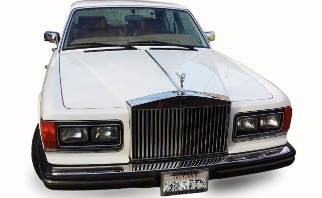 1986 WHITE ROLLS ROYCE SILVER SPUR: 38,400 miles. Clean brown leather interior.