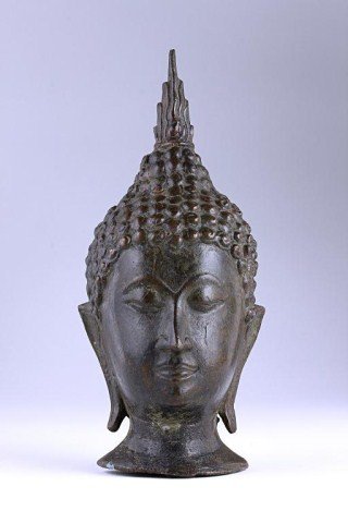 ANTIQUE THAI BRONZE BUDDHA HEAD: With tight coiled curls; wears pointed headpiece. H: 7 3/8 in.