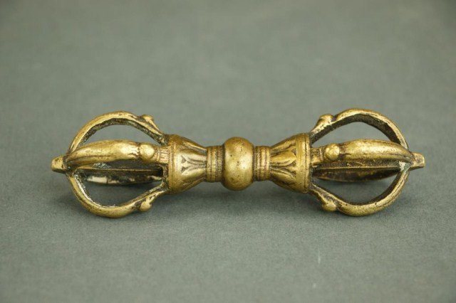 ANTIQUE BRONZE VAJRA: With four prongs; is a Buddhist ritual object that symbolizes indestructibility. L: 4 1/2 in.