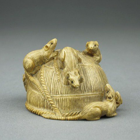 ANTIQUE JAPANESE CARVED NETSUKE: From the private collection of Mr. Paul Seigel. Figure of an upside down basket with rats scrambling upon it, with one coming from under the basket. Mark on underside of basket to read Tomokazu. Edo p