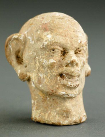 ANTIQUE POTTERY HEAD OF AN EARLY HUMAN FIGURE: From the British Museum's archaeology department. H: 3 in.