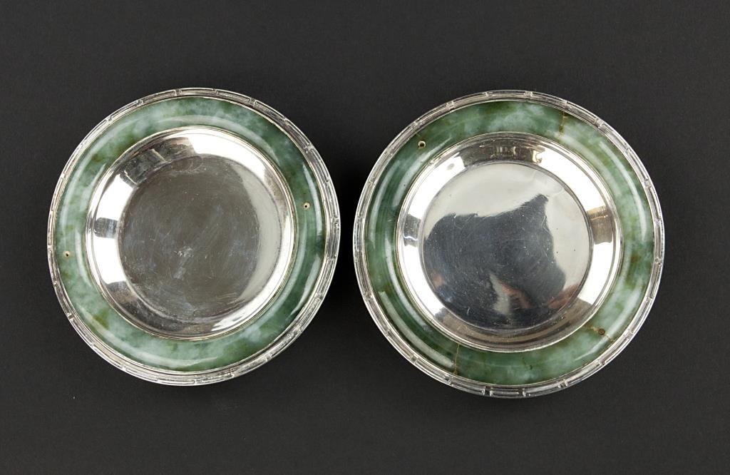 PAIR OF JAPANESE SILVER COASTERS WITH JADE: PAIR OF JAPANESE SILVER COASTERS WITH JADE The rim with mottled green jade. On three small feet. The base stamped to read "Yamanaka & Co. Made in Japan". From the Marlin collection of Beverly Hills, C