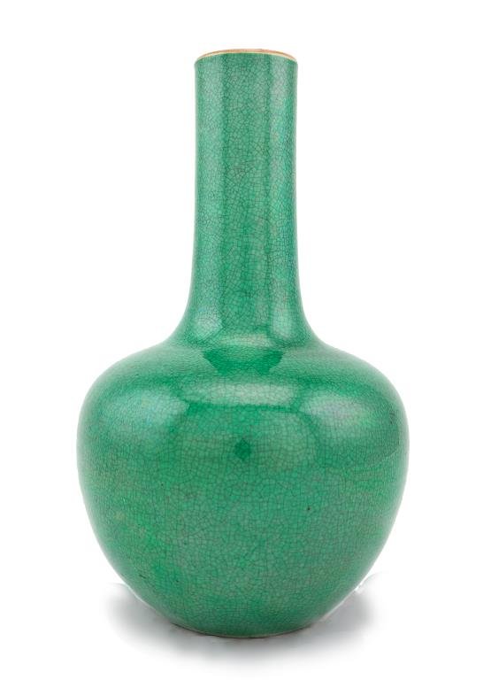 ANTIQUE JAPANESE GREEN BOTTLENECK VASE: ANTIQUE JAPANESE GREEN BOTTLENECK VASE Made for export during the Meiji period. Of tapering globular form, the vase is of a rich green tone with crackle to the glaze. From the Marlin collection of Bev
