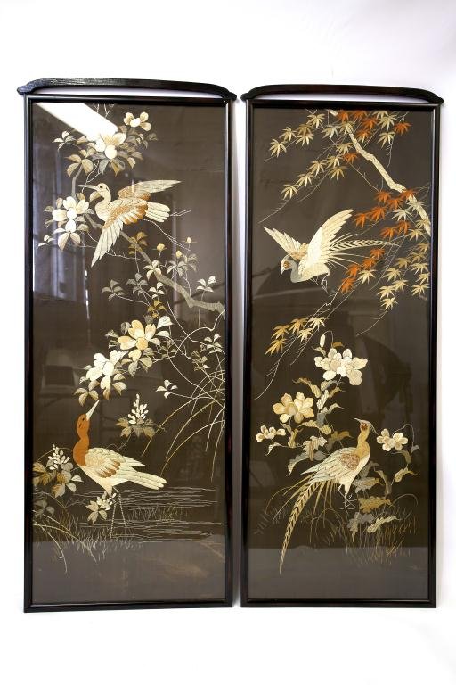 PAIR OF FRAMED JAPANESE SILK EMBROIDERIES: In muted tones against black cotton background. One with two Japanese pheasants among maple branches and peonies; the other with two cranes among camellia branches. (One has a tear.) From a private es