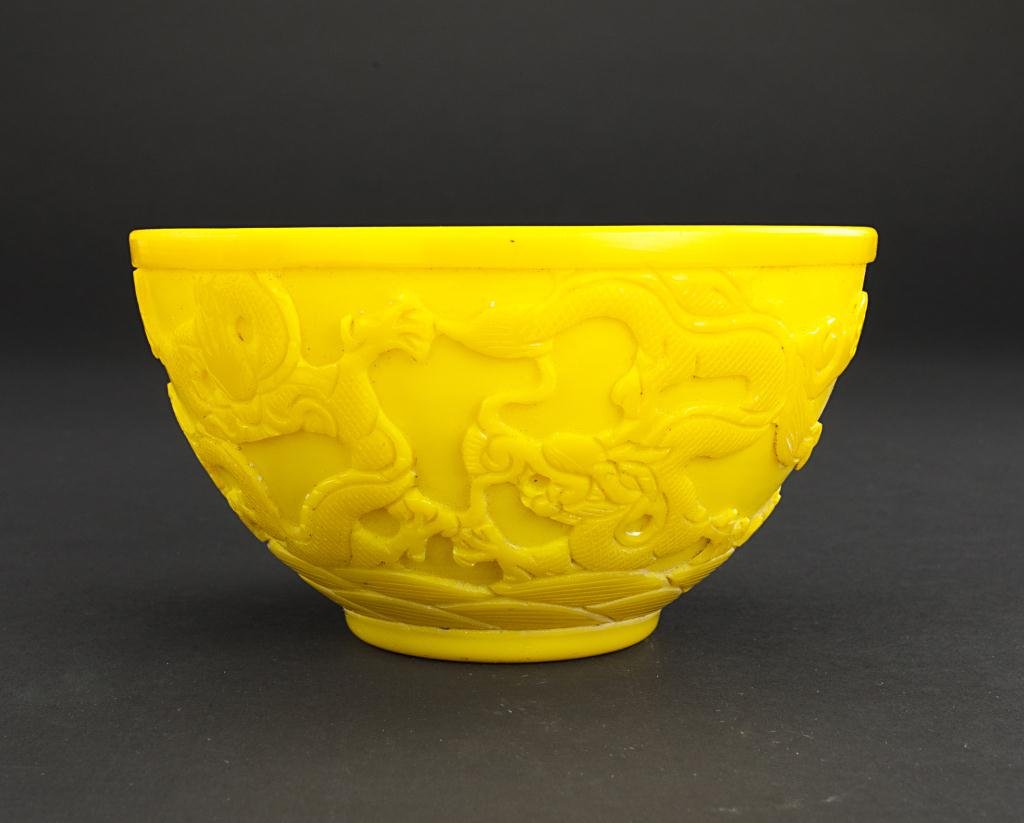 CHINESE YELLOW PEKING GLASS BOWL: With raised coiled dragons decorating the exterior. Mark to bottom. H: 3 3/8 in., D: 6 1/8 in.
