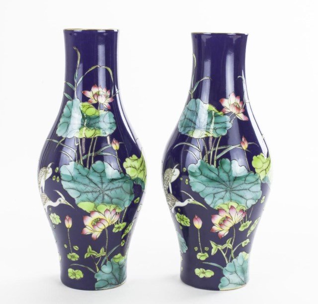 PAIR OF SMALL CHINESE COBALT GROUND VASES: The entirety painted with lotus flowers and lily pads decorating the body. Mark to bottom. H: 7 in.