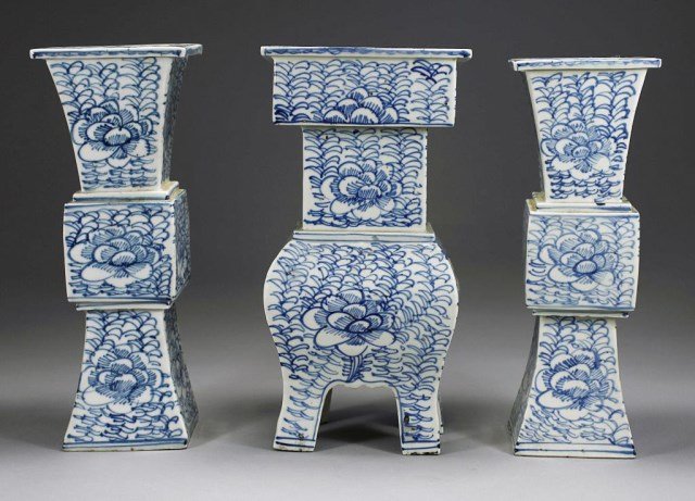 CHINESE BLUE AND WHITE PORCELAIN CENSER GARNITURE: Decorated with flower and leaves design, each in a square form. Centerpiece is on four raised feet. H: 10 3/8 in.