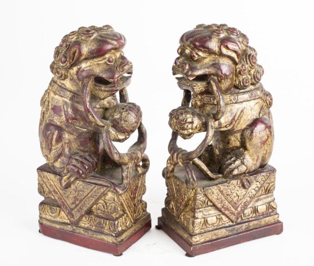 PAIR OF SMALL CARVED FOO DOGS: With a loose hanging ring in each mouth. H: 9 5/8 in.