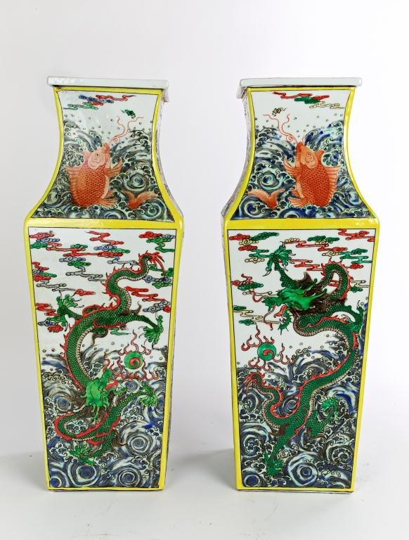 PAIR OF CHINESE FAMILLE VERTE SQUARE VASES: The body painted with scrolling dragons to each side and the neck painted with large fish amongst choppy waves. H: 17 in.