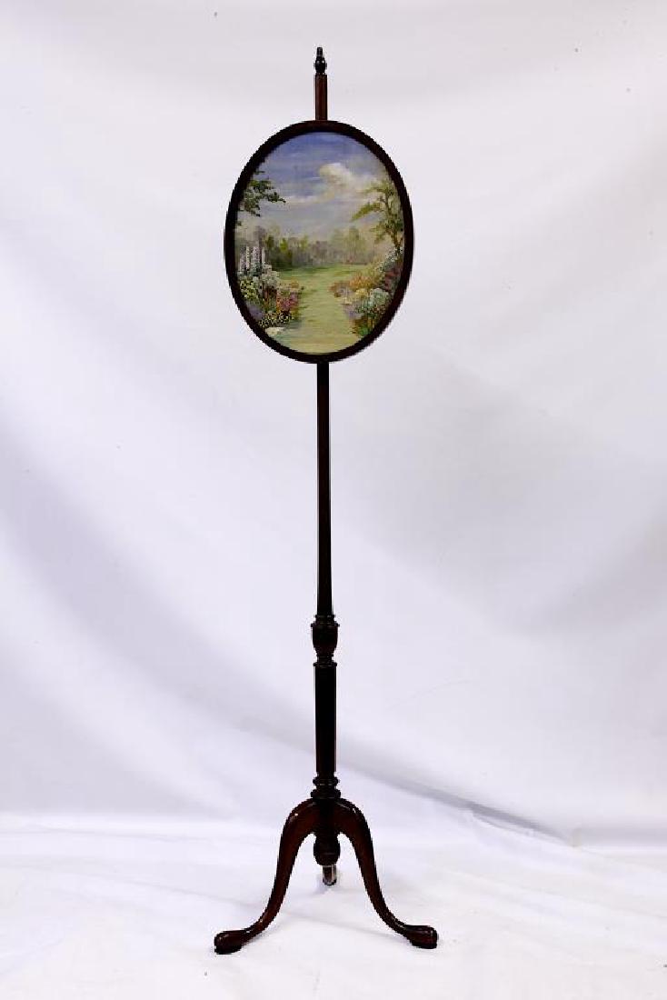 ANTIQUE FRAMED PAINTING ON SILK: Painted of a luxury garden with blossoming flowers on silk in an oval shaped frame. On a tall stand. H: 14 3/8 in L: 11 1/2 (stand H: 60 in.)