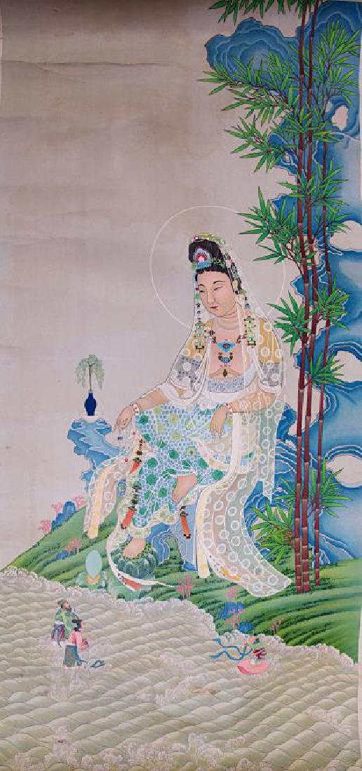 CHINESE SCROLL PAINTING OF GUANYIN: Finely painted of a seated Guanyin dressing in an elaborated robe amongst rockery next to a river. H: 28 1/2 in., L: 13 3/8 in.