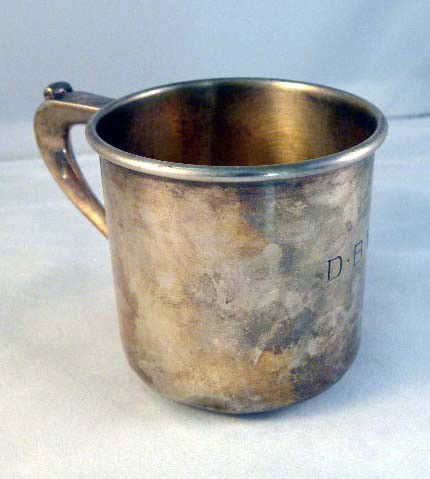 A GORHAM STERLING SILVER TEA CUP with handle and m: A GORHAM STERLING SILVER TEA CUP with handle and monogrammed detail with small dent 2"; approx 56.85